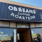 building and front entrance of the OB Beans Coffee Roasters coffee shop located in Ocean Beach, San Diego, California