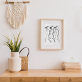 abstract nude female figure art print, minimalist nude figure art print framed hanging on an entryway of a home